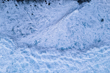 Foam waves of on Atlantic Ocean aerial top down view, Powerful storm on the sea