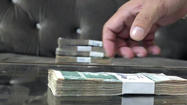 stacking hard cash pakistani rupees