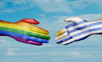 Uruguay and LGBT movement country handshaking with flags, consensus concept international co-operation illustration