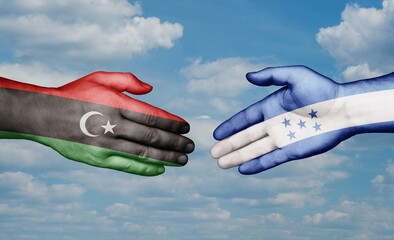 Honduras and Libya country handshaking with flags, consensus concept international co-operation illustration