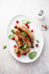 Homemade sausages with spinach and cranberry