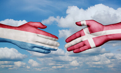 Denmark and Luxembourg country handshaking with flags, consensus concept international co-operation illustration