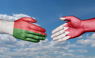 Bahrain and Madagascar country handshaking with flags, consensus concept international co-operation illustration