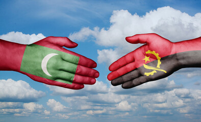 Maldives and Angola country handshaking with flags, consensus concept international co-operation illustration