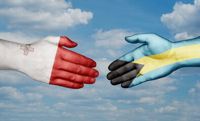 Bahamas and Malta country handshaking with flags, consensus concept international co-operation illustration