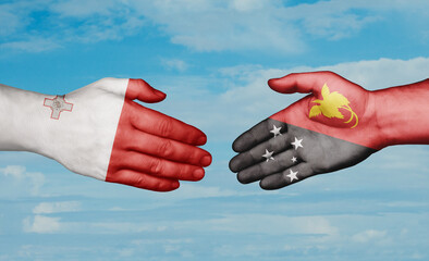 Papua New Guinea and Malta country handshaking with flags, consensus concept international co-operation illustration