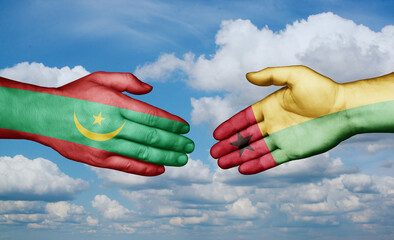 Guinea-Bissau and Mauritania country handshaking with flags, consensus concept international co-operation illustration