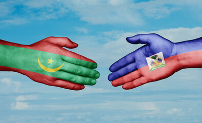 Haiti and Mauritania country handshaking with flags, consensus concept international co-operation illustration