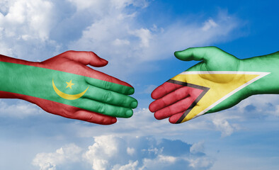 Mauritania and Guyana country handshaking with flags, consensus concept international co-operation illustration