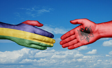 Mauritius and Albania country handshaking with flags, consensus concept international co-operation illustration