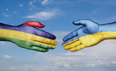 Ukraine and Mauritius country handshaking with flags, consensus concept international co-operation illustration