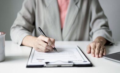 Business woman employer holding resume hiring recruit looking cv resume to hire candidates, analyzing information before job interview. Recruitment concepts