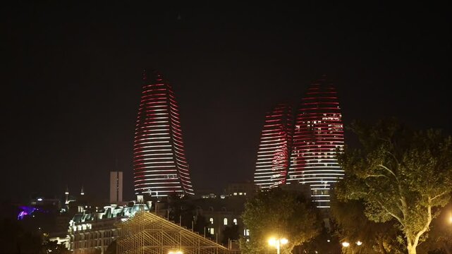Baku, Azerbaijan A night view of colourful projections on the landmark Flame Towers at night. 
