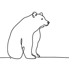 A bear is sitting on a ledge. The bear is looking at the camera. The bear is black and white