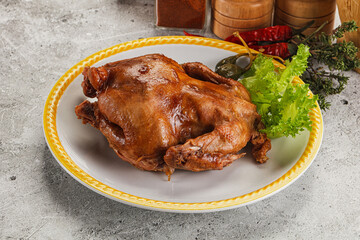 Baked small chicken with spices