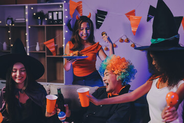 Joyful office Halloween party with coworkers in costumes, celebrating with drinks and laughter, fostering teamwork and festive spirit