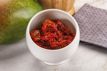 Spicy pickled raw green mango