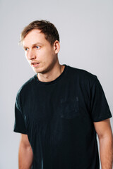 Casual portrait of a young man in a simple setting.