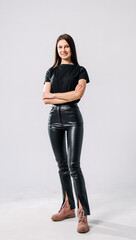 Confident woman in stylish black outfit.