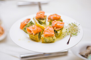 Stylish plate of tasty salmon bites.