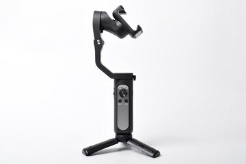 Gimbal stabilizer for Smartphone isolated on white background. Modern stabilizer-gimbal for photo-video shooting. Gadgets for blogging, streaming, video and videography