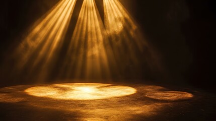 Obraz premium Golden beams illuminate a dark space, casting a warm glow on the ground, creating a serene and dramatic atmosphere.