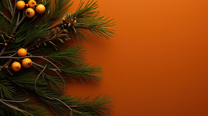 Top view of tree branches with Christmas ornaments and details on a dark orange background