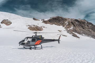 Helicopter landing in mountains, Fox Glacier, New Zealand