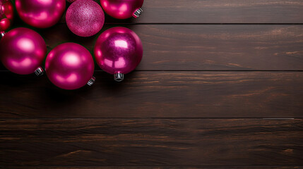 Naklejka premium Set of christmas balls on a dark magenta wooden background or board