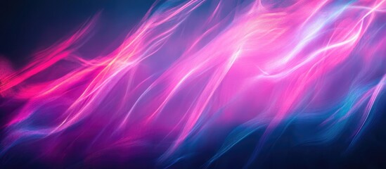 Fototapeta premium Vertical abstract image with long exposure effect featuring pink violet and blue hues against a dark backdrop