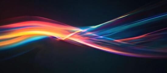 Photography of a rainbow against a dark backdrop Abstract web imagery suitable for banners and panels Unique and surreal design element showcasing light dispersion