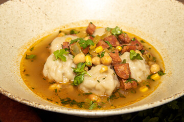 A delicious plate of Pork Dumplings Chorizo and Sweetcorn Broth