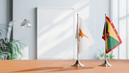 FLAGS OF CYPRUS AND GRENADA ON TABLE