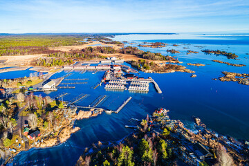 Aerial view of the tranquil harbor in Sunnana, Sweden during the calm low season with boats...