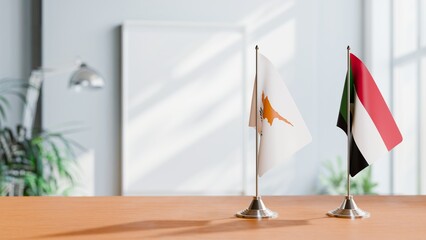 FLAGS OF CYPRUS AND SUDAN ON TABLE