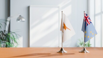 FLAGS OF CYPRUS AND TUVALU ON TABLE