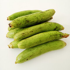 A group of Sponge gourds is isolated on a white background.  Closeup on Luffa. loofa. Okra. Sponge gourd.