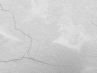 Abstract background of cracks and imperfections  concrete or cement wall, rough gray gradient texture and pattern. the aging process of building materials.