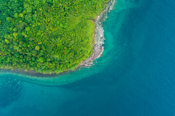 Exotic idyllic sea rocky island turquoise sea bay with green tree forest