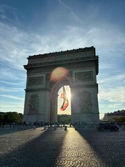 arc de triomphe, arch of triumph in paris france with french flag