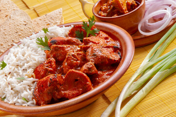 Chicken Tikka with jeera rice with papadum and mango pickle and sliced onion   