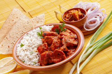 Chicken Tikka with jeera rice with papadum and mango pickle and sliced onion   