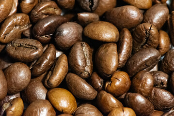 Roasted black coffee beans close up
