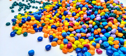 Red masterbatch granule, red polypropylene polymer granules, cold cutting type granule texture, isolated on white background, for industrial plastic company profile product catalog design