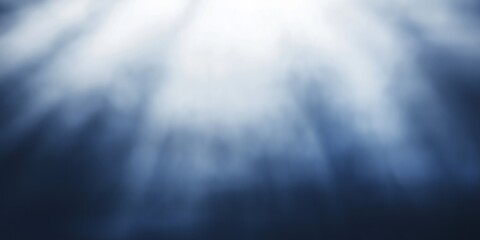 Fototapeta premium Dramatic light rays filter through an unseen source, casting a mystical and otherworldly effect through a cloudy medium.