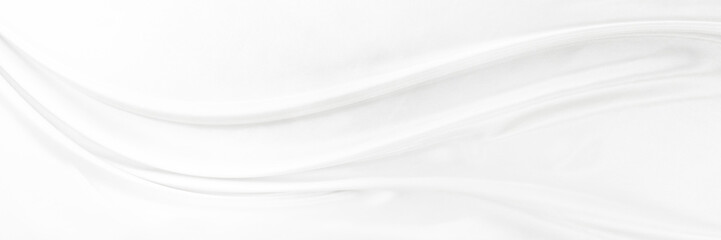 White gray satin texture that is white silver fabric silk panorama background with beautiful soft blur pattern natural.