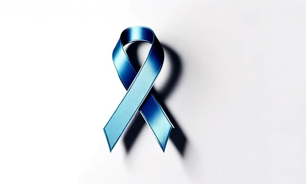 Ruban bleu en satin pos&eacute; sur fond blanc avec ombre marqu&eacute;e, symbole de soutien pour Movember et la lutte contre le cancer de la prostate c&eacute;l&eacute;br&eacute;e en novembre