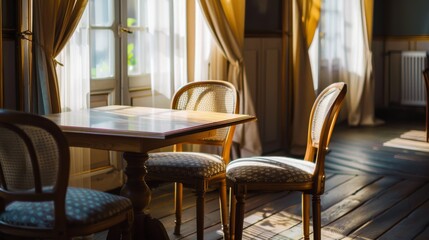 Fototapeta premium Sunlight pours through large windows into a quaint dining room with an elegant wooden table and chairs, creating a warm and inviting atmosphere.
