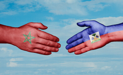 Haiti and Morocco country handshaking with flags, consensus concept international co-operation illustration