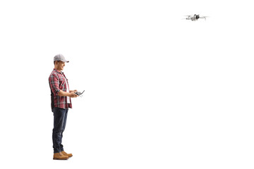 Full length shot of a guy flying a drone